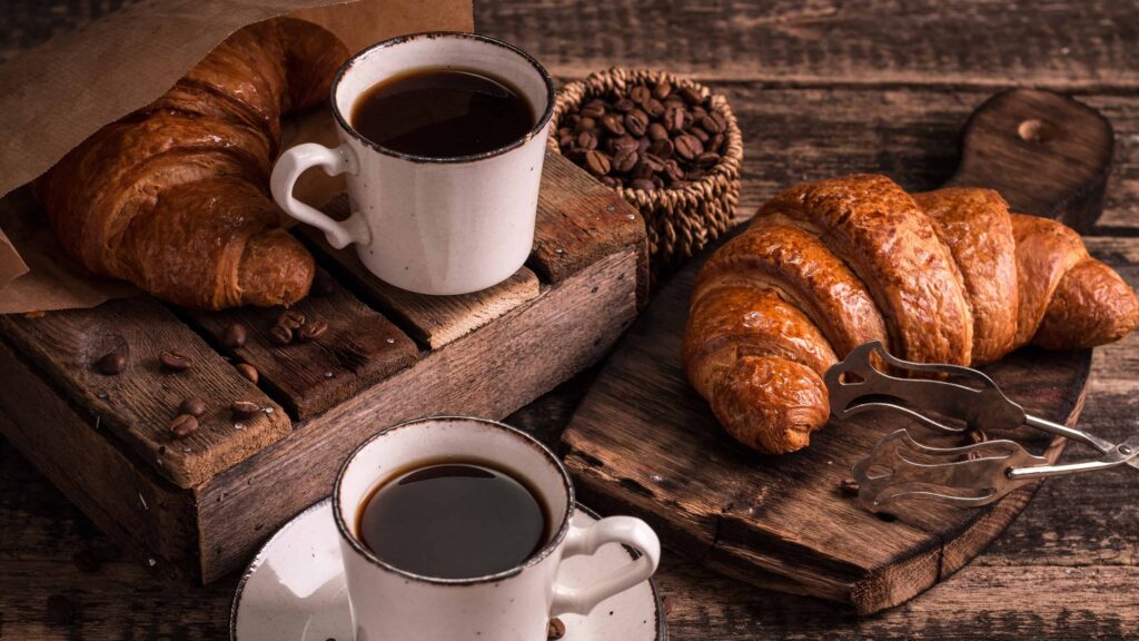 Coffee cups and croissant